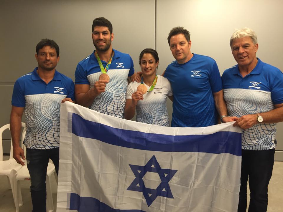 שבו הביתה בשלום | צילום מתוך עמוד הפייסבוק של הוועד האולימפי בישראל כוחותינו שבו בשלום לבסיסם